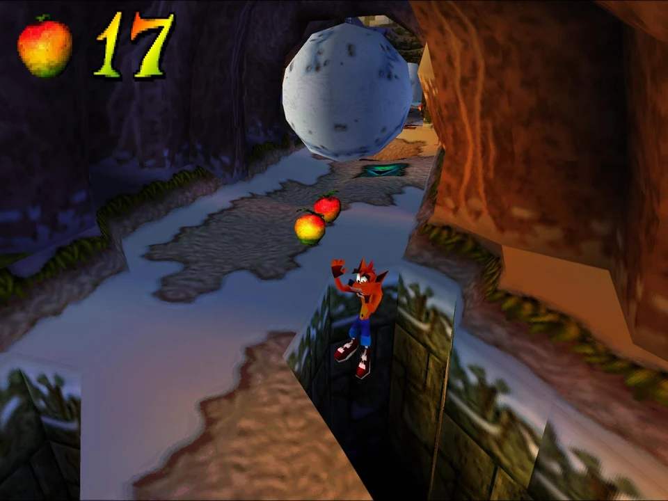 Crash dives down a cliff under a full moon in a nighttime level of Crash Bandicoot 2
