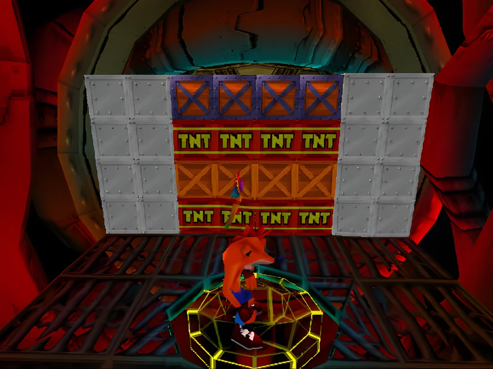 Crash facing a wall of TNT crates in a level of Crash Bandicoot 2 on PS1