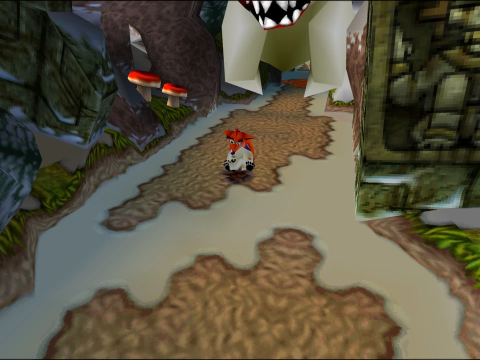 Crash advances on a path lined with stone statues in a level of Crash Bandicoot 2