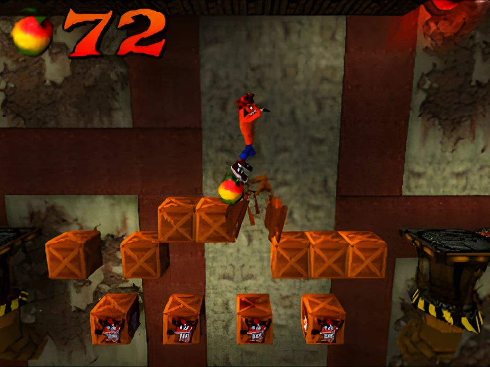 Crash jumps to the top of a pyramid of crates in a side view of Crash Bandicoot
