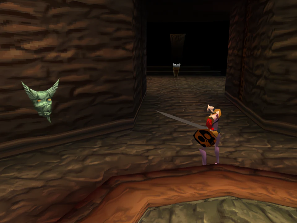 MediEvil PS1: a shopping mall gargoyle A gargoyle on a stone wall in front of Sir Daniel in MediEvil